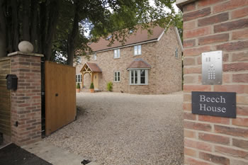 view of new property through gate posts